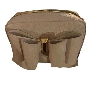 Crossi bow bag in blush Taupe with gold hardware